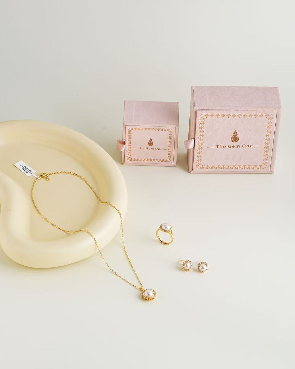 Regal Pearl and Gold Jewelry Set with Necklace, Earrings, and Ring