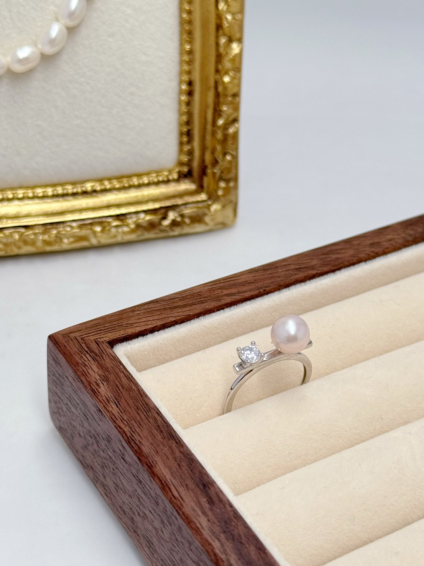 Elegant Pearl and Cubic Zirconia Engagement Ring